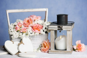 Beautiful Romantic Composition of candle, hearts and flowers