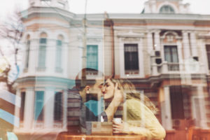 Couple in love drinking coffee in coffee shop