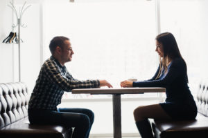 Man and woman in discussions in the restaurant.