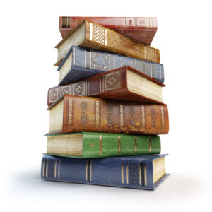 Old books. Stack of vintage books isolated on white.