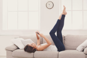 Online. Girl texting on smartphone