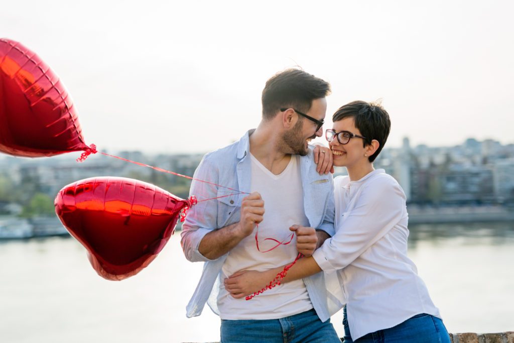 Sentimental happy couple in love bonding and smiling