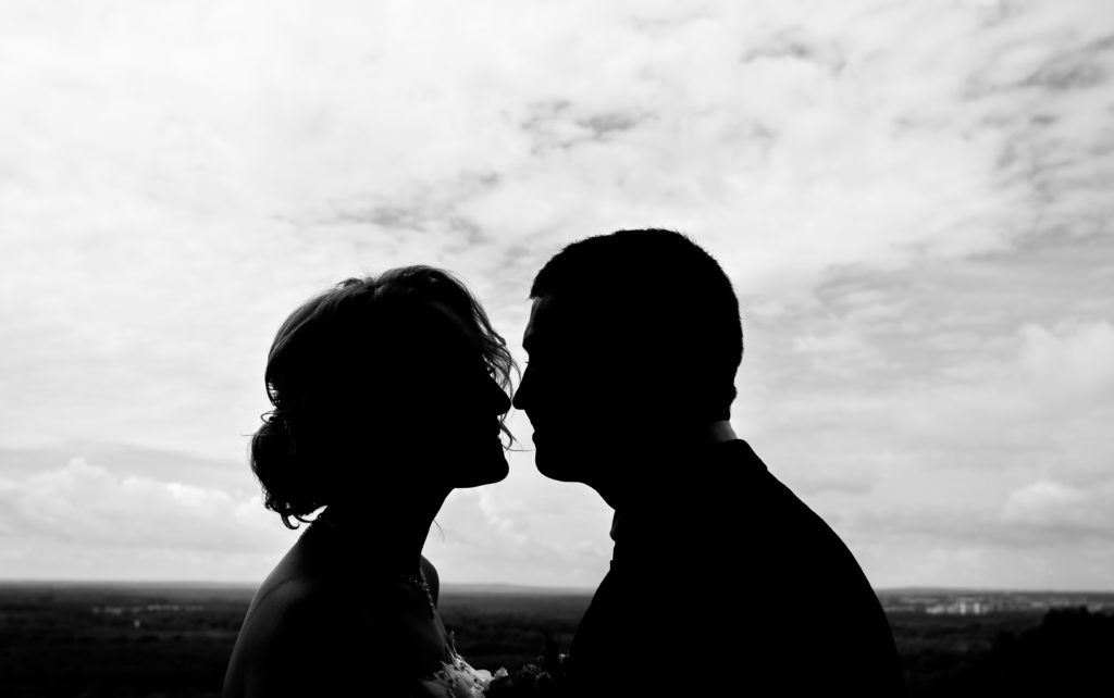 Silhouette couple kissing outdoors