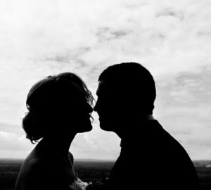 Silhouette couple kissing outdoors