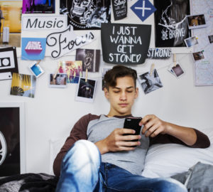 Teenage boy using smartphone
