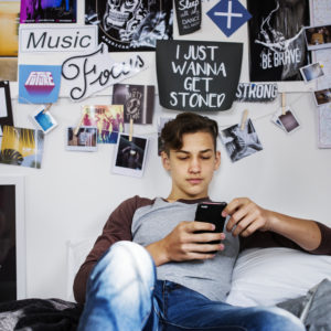 Teenage boy using smartphone