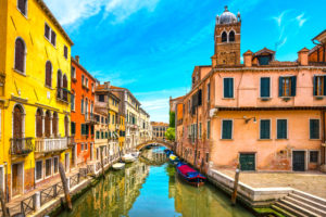 Venice cityscape, water canal, campanile church and traditional