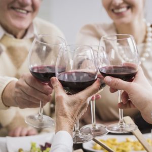 Happy family toasting granparents anniversary